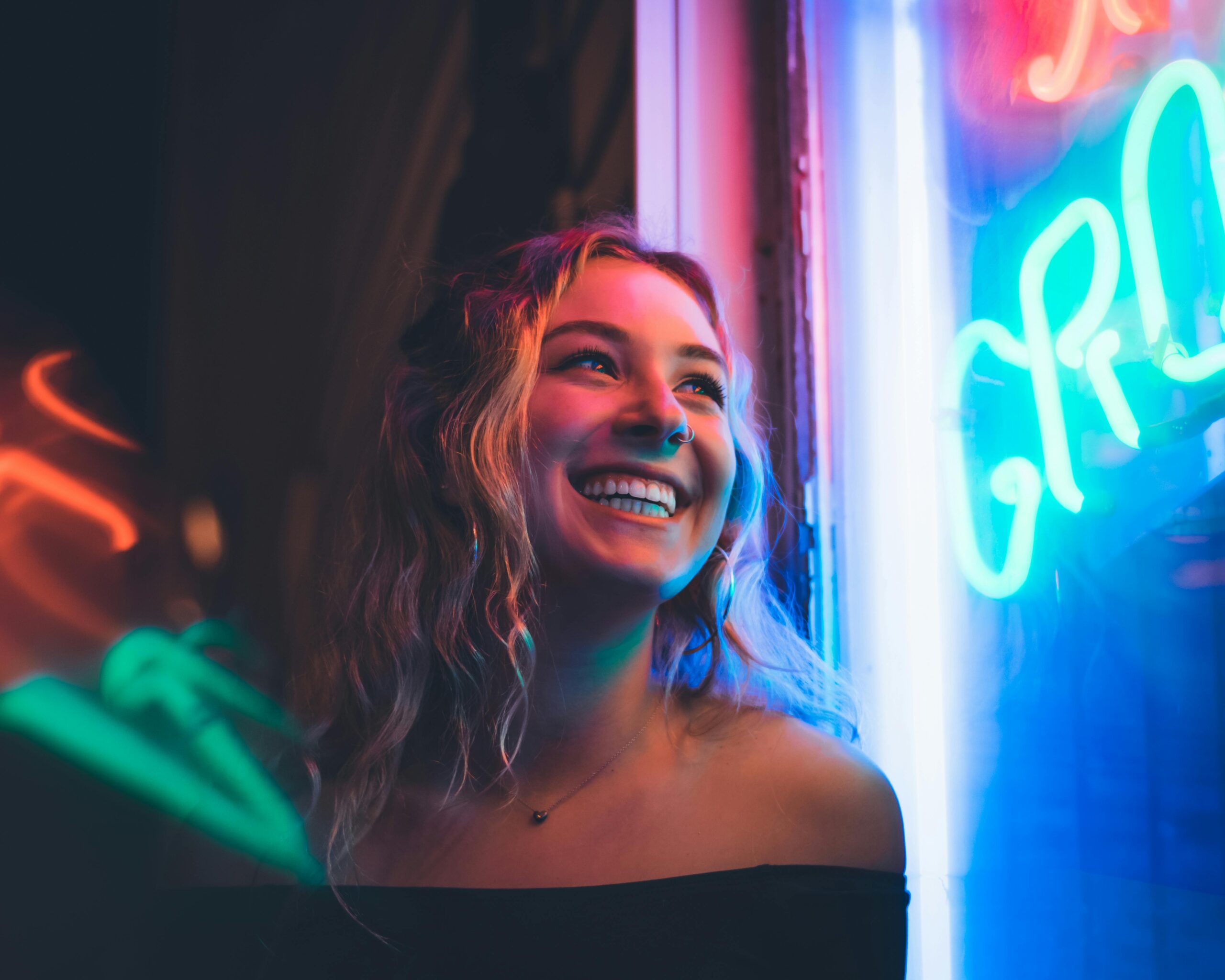 A woman smiling thanks to our dental health tips.